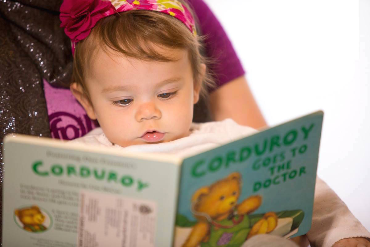 Cute baby with book