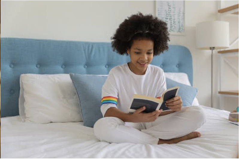 Child Reading in Bed