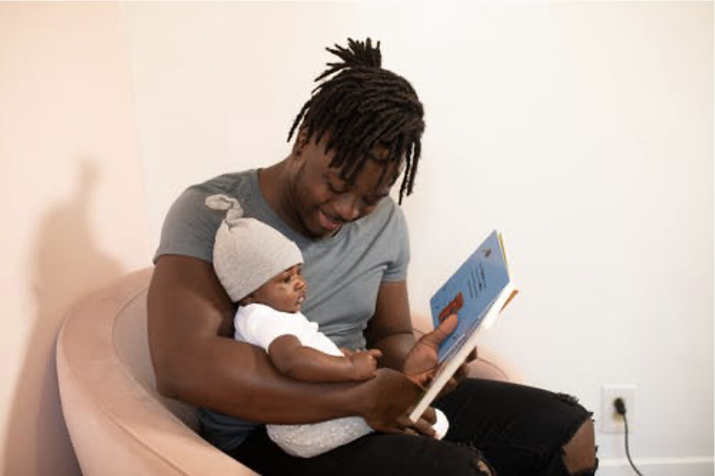 Dad reading to baby